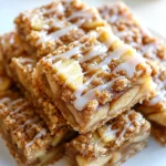 Homemade chewy apple bars with cinnamon crumble topping and caramel drizzle