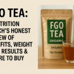 A kraft paper bag labeled "FGO Tea Organic" with a clear glass cup of tea beside it, placed on a wooden surface. Bold black text on the left reads: "FGO Tea: A Nutrition Coach’s Honest Review of Benefits, Weight Loss Results & Where to Buy."