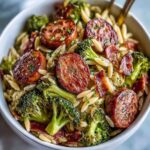 One-pan Chicken Sausage Broccoli Orzo dinner with parmesan and lemon zest.
