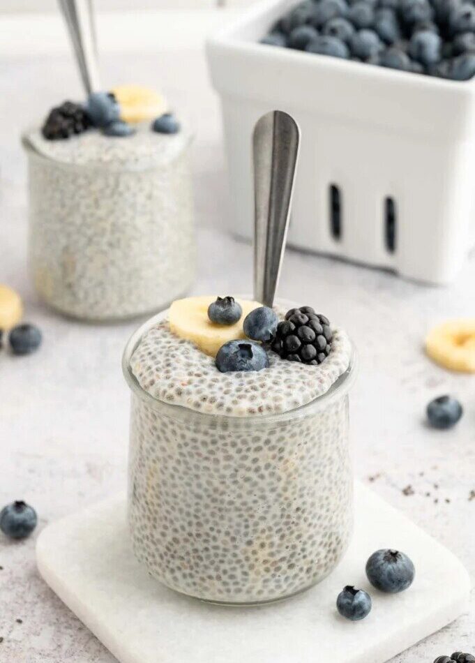 Vanilla chia pudding topped with fresh strawberries, blueberries, and granola