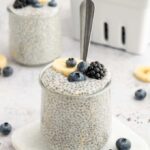 Vanilla chia pudding topped with fresh strawberries, blueberries, and granola