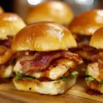 Maple Chicken & Beef Bacon Sliders served on toasted buns with maple syrup glaze and crispy bacon